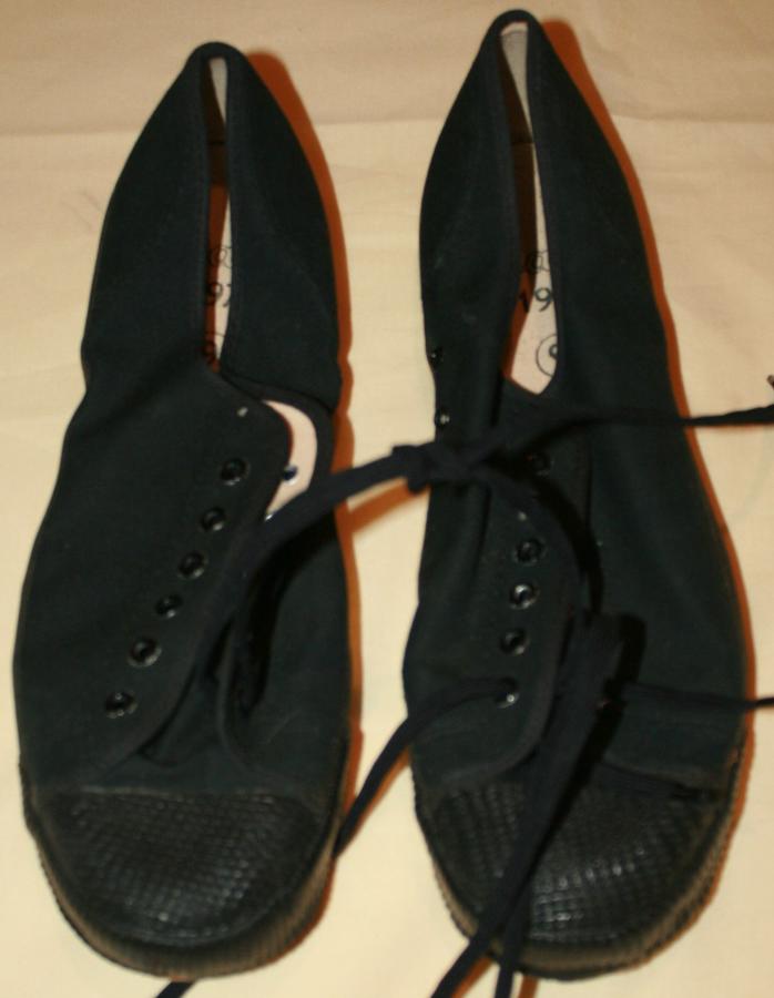 A MINT PAIR OF 1970 DATED BLACK PLIMSOLLS