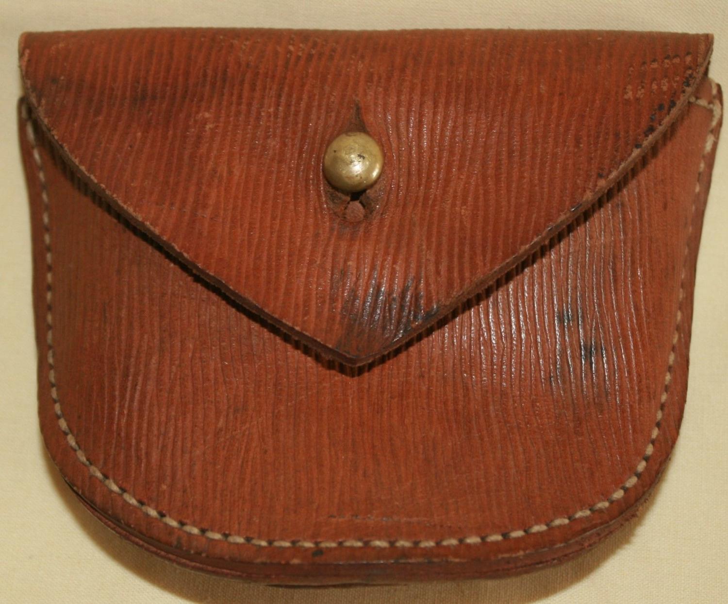 A 1917 DATED PISTOL AMMO POUCH LOOP TYPE FITTING