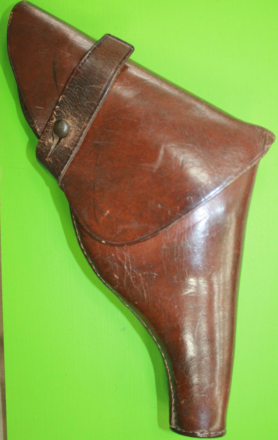 A 1916 DATED PRIVATE PISTOL HOLSTER MADE BY HGR SMALL SIZE