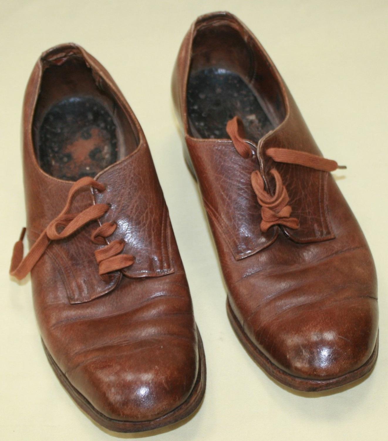 A PAIR OF ATS 1944 DATED SHOES