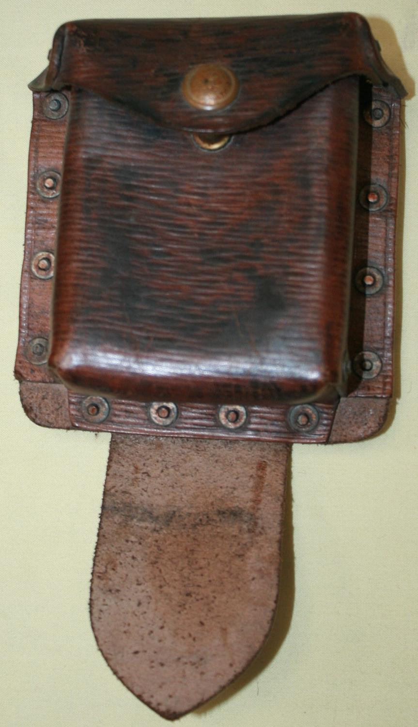A 39 PATTERN LEATHER EQUIPMENT PISTOL AMMO POUCH WITH ITS REAR STRAP