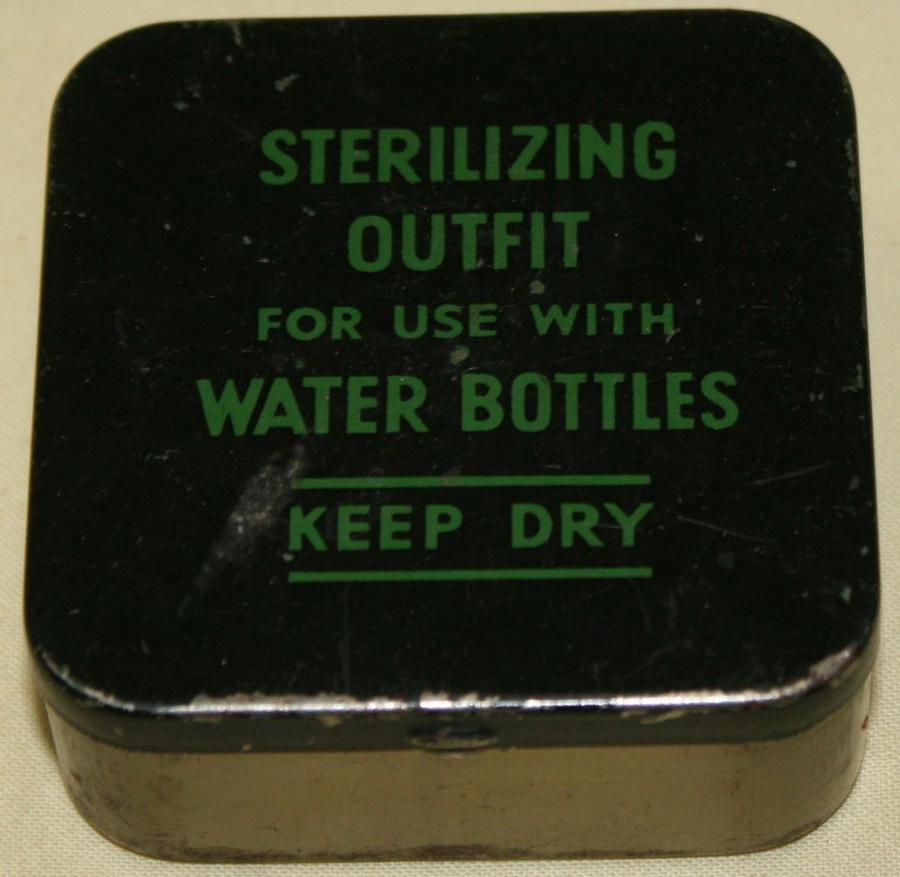A LATE WWII SCREW CAP WATER STERILIZING OUT FIT