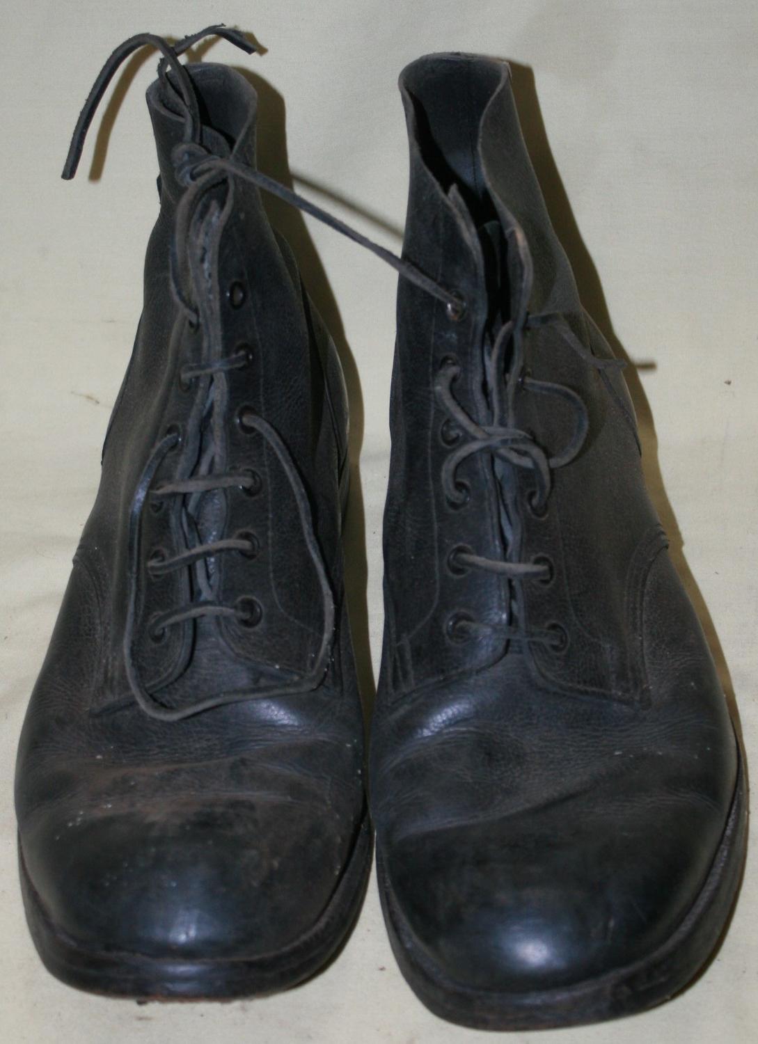 A PAIR OF 1944 DATED NAVY ISSUE BOOTS SIZE 11