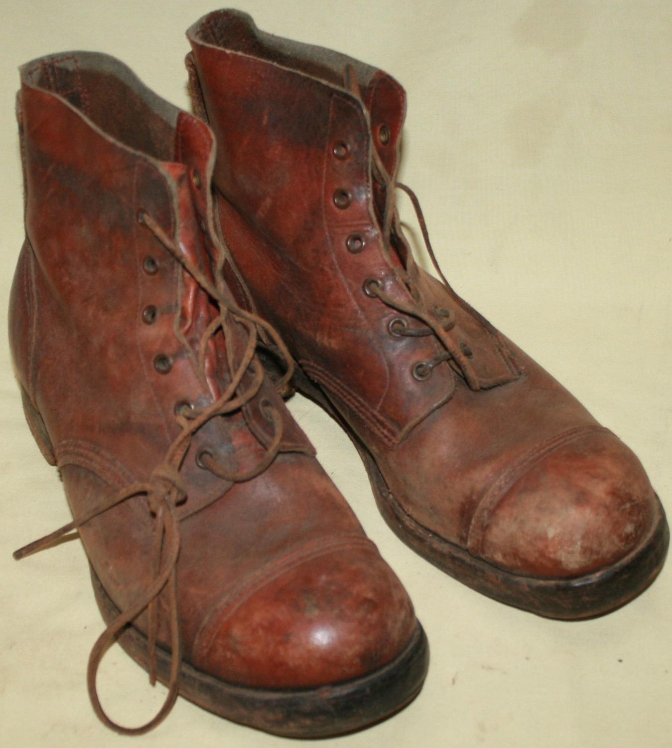 A GOOD USED PAIR OF 1944 DATED JUNGLE BOOTS SIZE 9 M