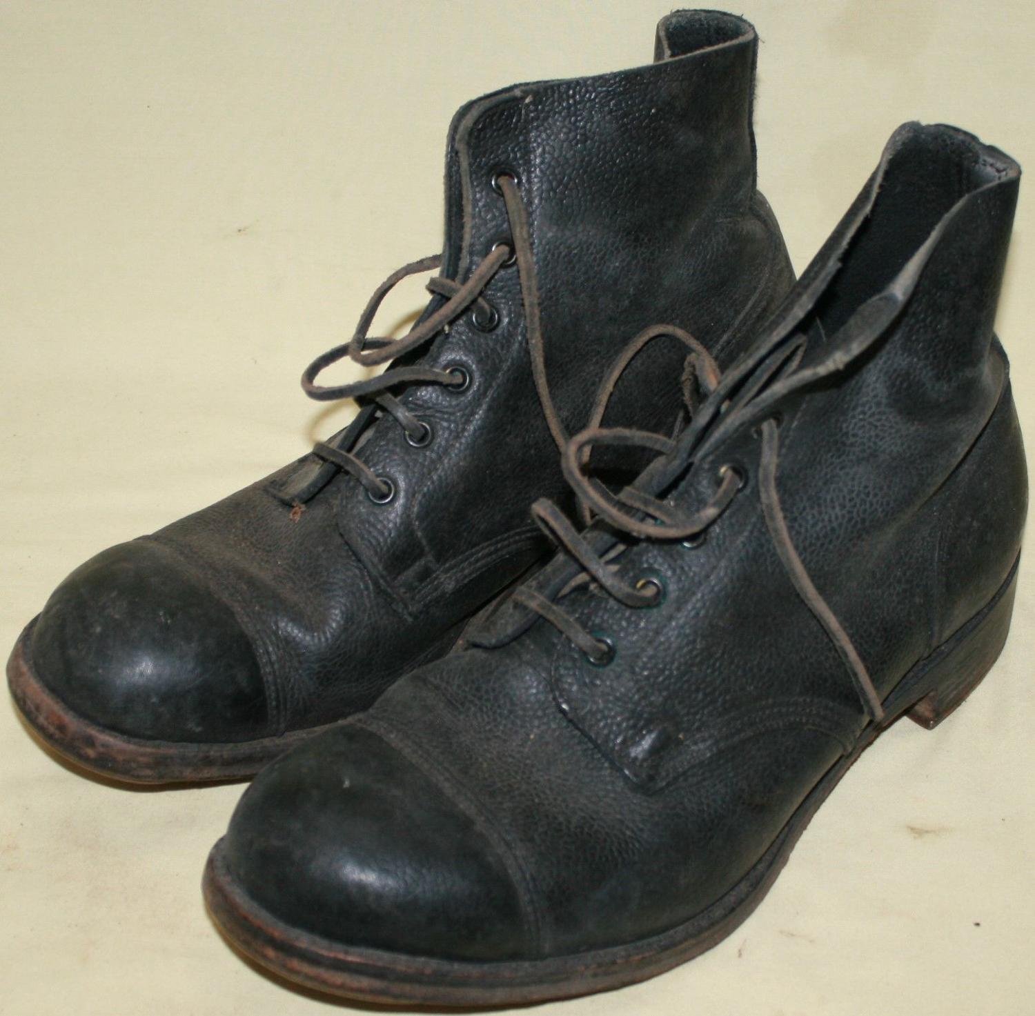 A GOOD PAIR OF SIZE 10 M AMMO BOOTS 1954 DATED