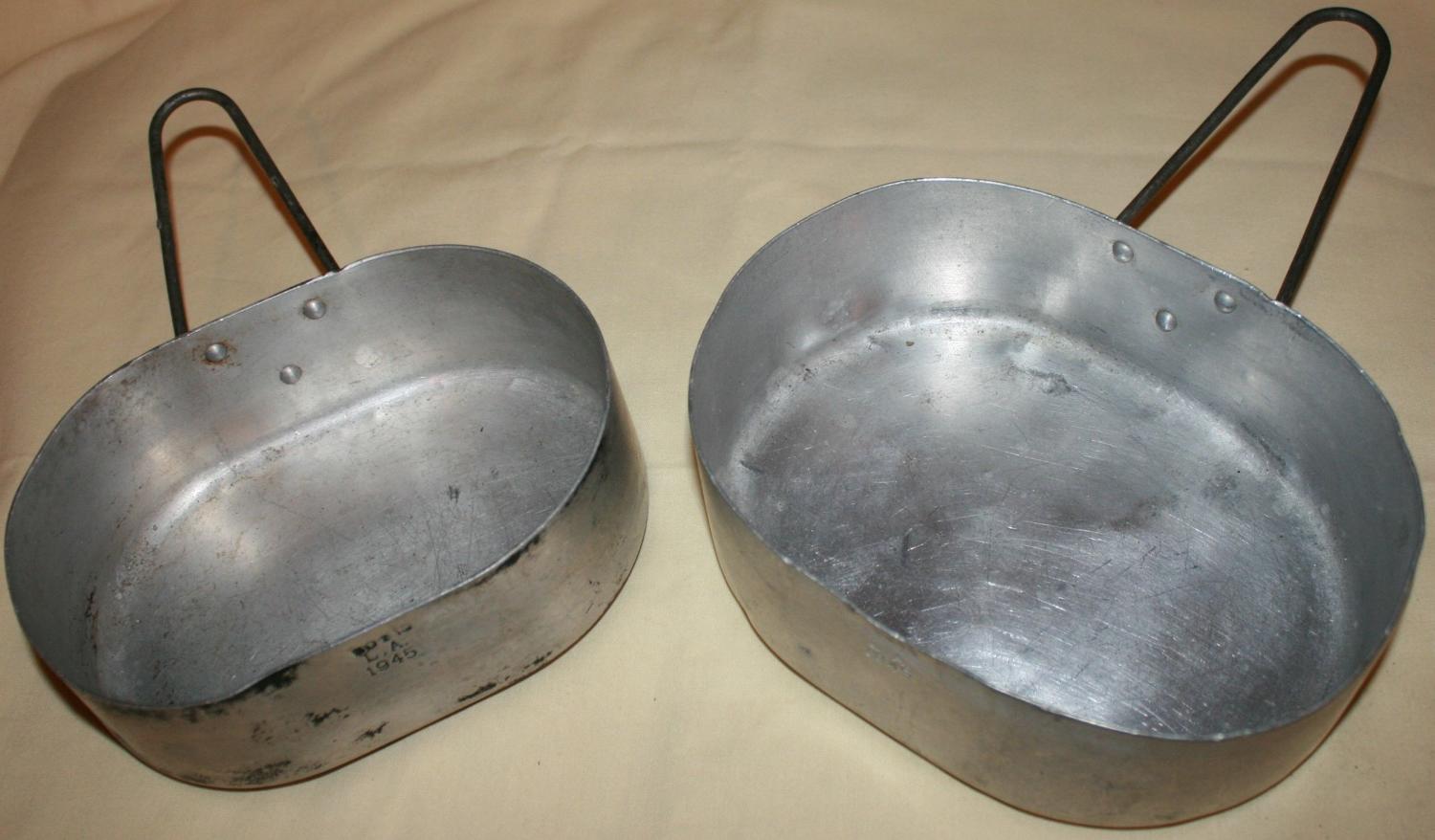 A PAIR OF THE INDIAN OVAL ALUMINUM MESS TINS 45 DATED