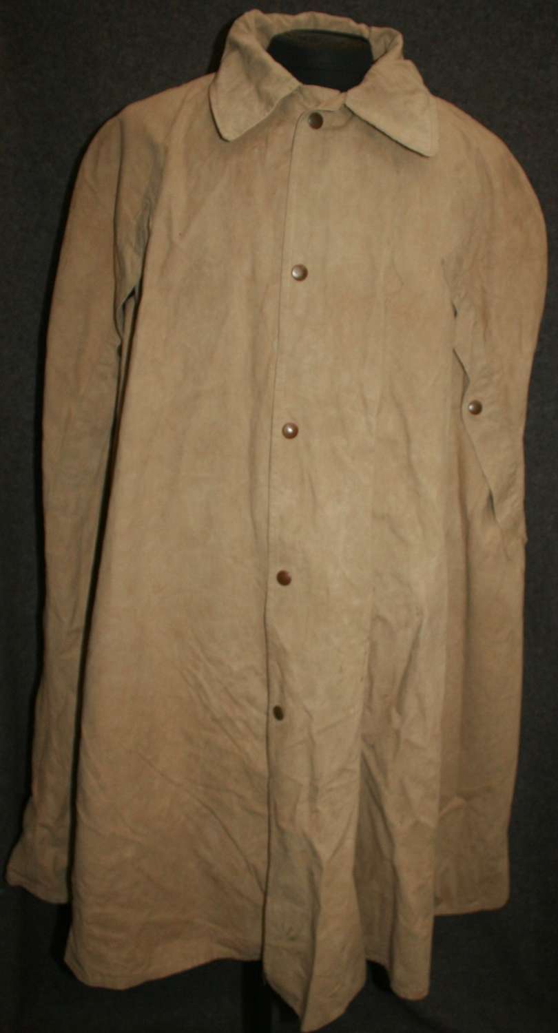 A TAN INDIAN MADE MONSOON CAPE 1944 DATED