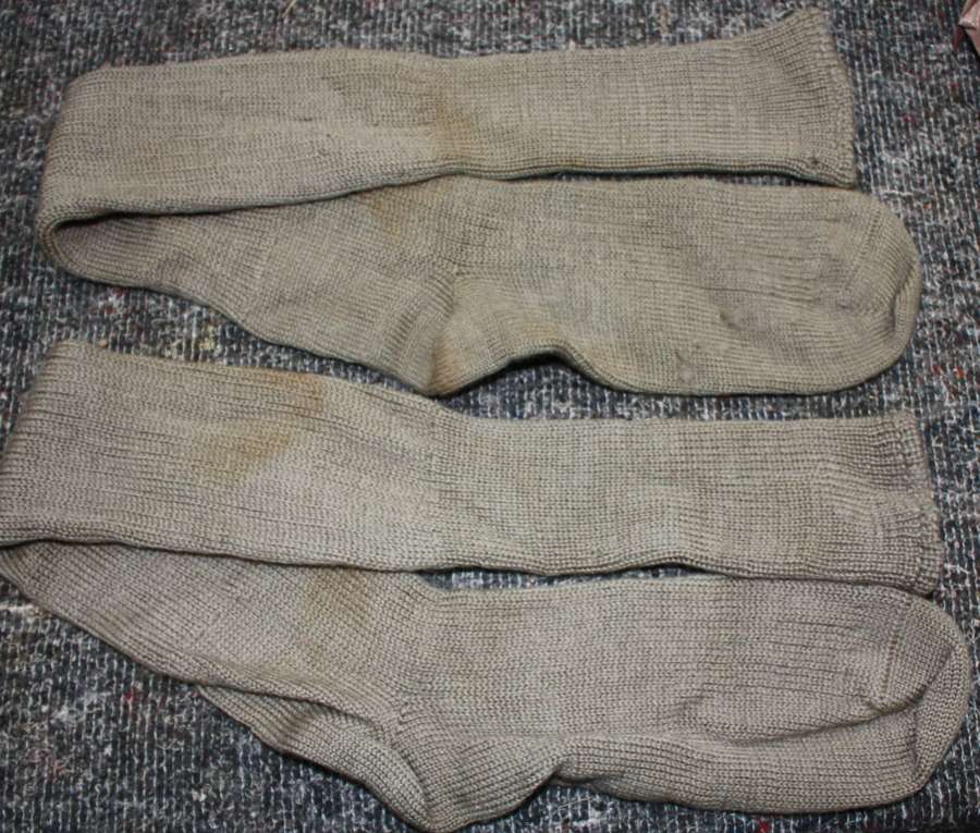 A PAIR OF THE KNEE LENGTH ARMY 1945 DATED SOCKS