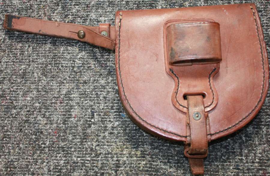 A 1940 DATED CAVALRY HORSE SHOE POUCH WITH SHOE
