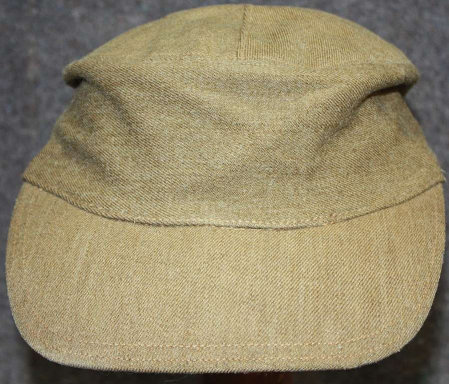 A GOOD WWII BRITISH ARMY MOUNTAIN TROOP CAP WHICH IS 1943 DATED