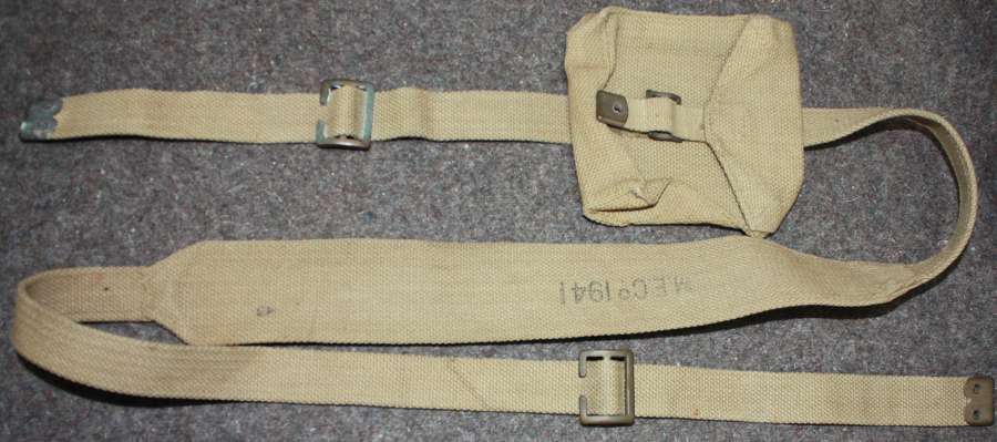 A 1941 DATED FLARE CARTRIDGE TIN SHOULDER STRAP