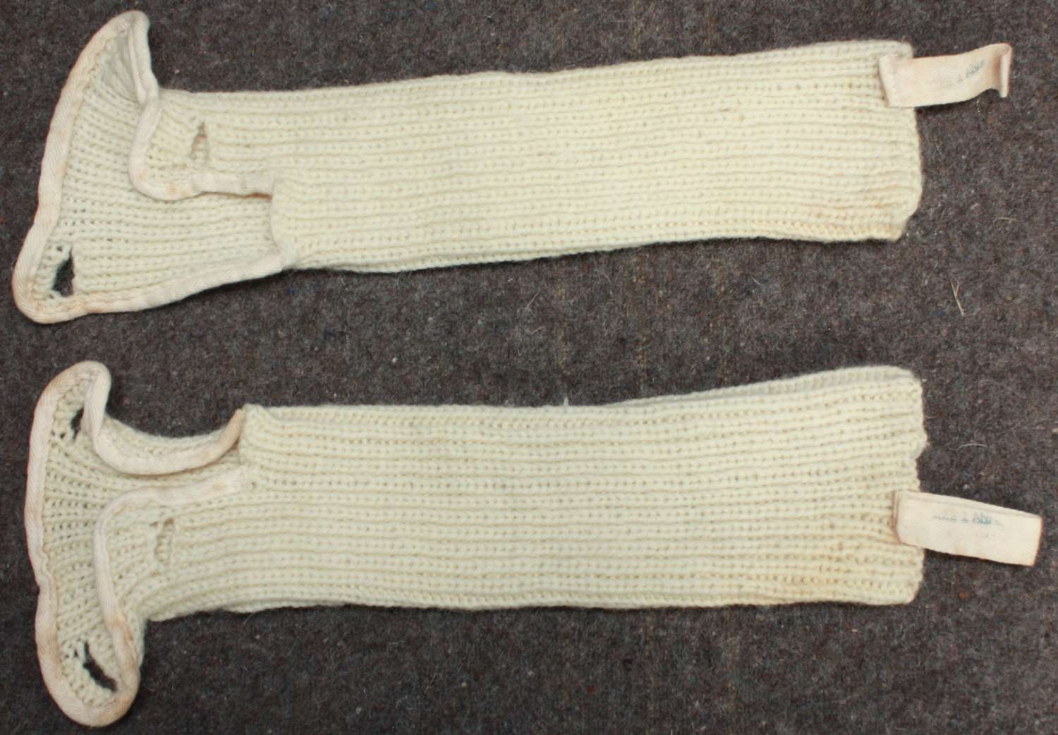 A WWII PERIOD OF ARM WARMERS WORN WITH THE SNOW EQUIPMENT
