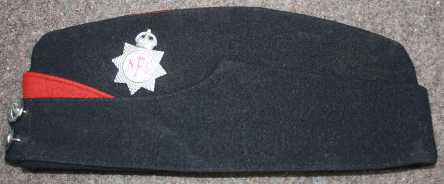 A WWII PERIOD NATIONAL FIRE SERVICE SIDE CAP NAMED TO A LADY