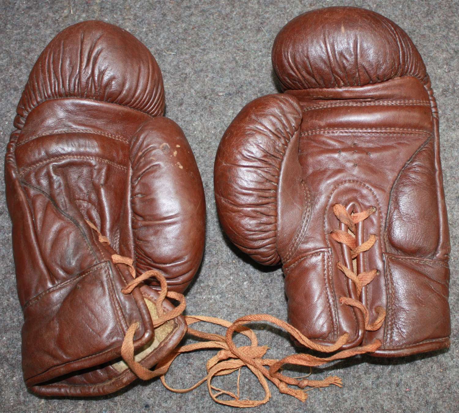 A RARE PAIR OF WWII 1942 DATED BRITISH FORCES BOXING GLOVES