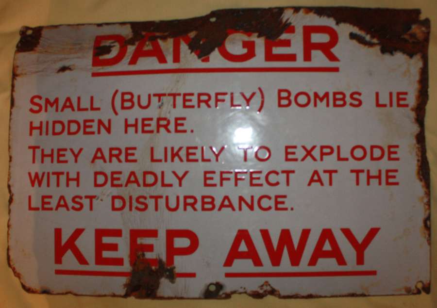 A FAIRLY GOOD USED EXAMPLE OF THE BUTTERFLY BOMB WARNING SIGN