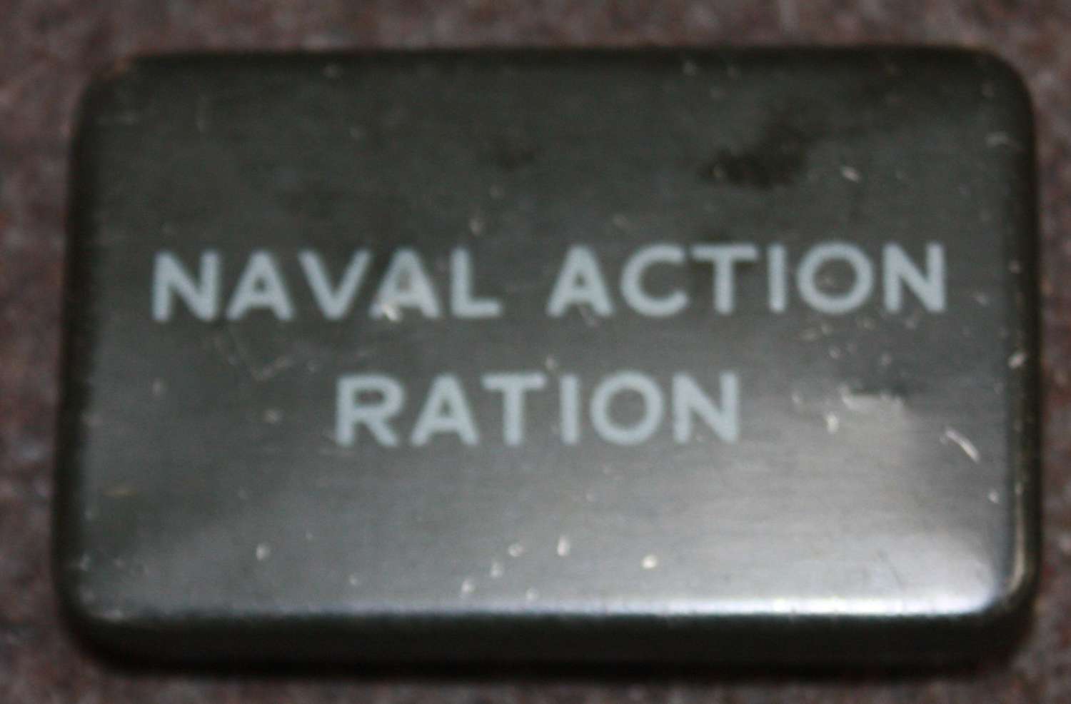 A GOOD WWII EMPTY NAVY ACTION RATION TIN