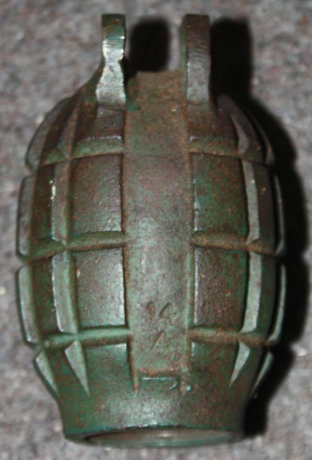A MILLS BOMB WHICH HAS BEEN REPAIRED ( EAR )