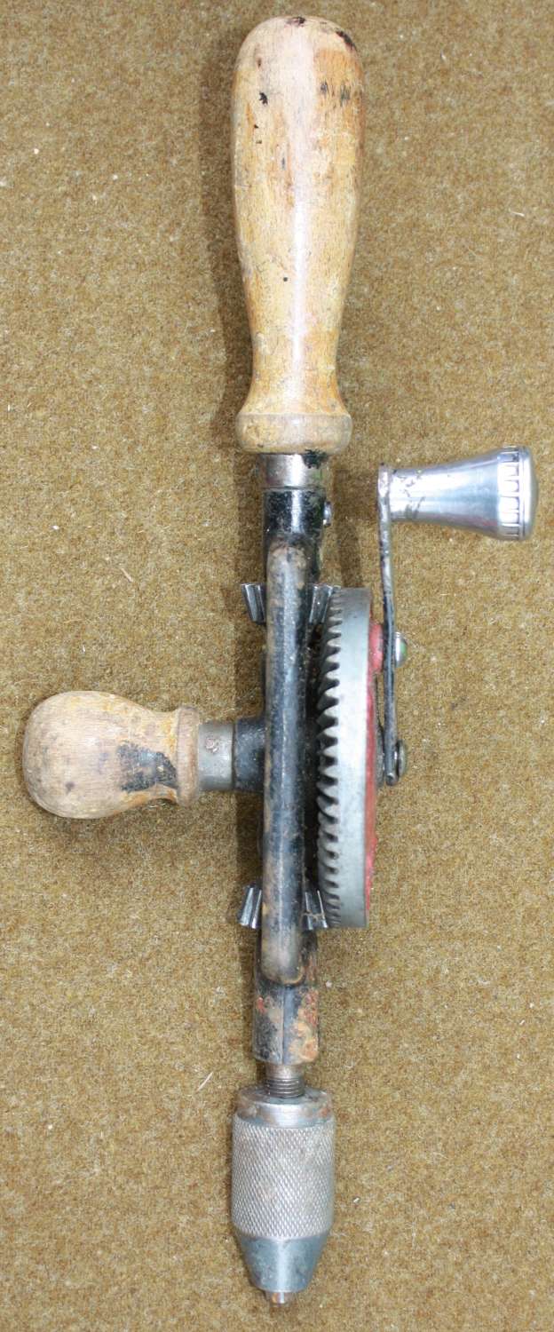 A 1952 DATED WOOD HAND DRILL