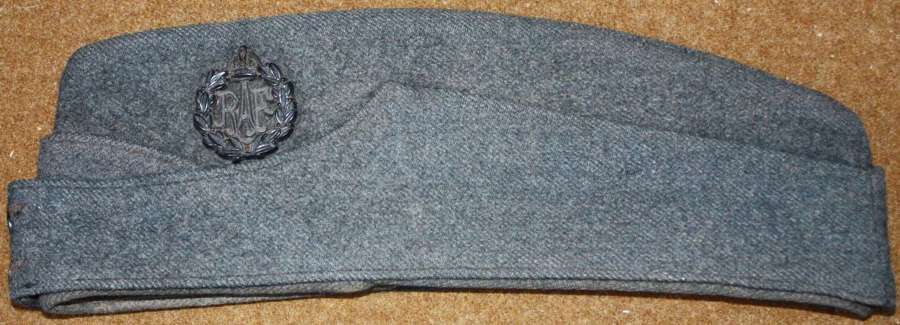 A WWII RAF SIDE CAP SIZE IS ABOUT A 7 1/4 PLASTIC CAP BADGE