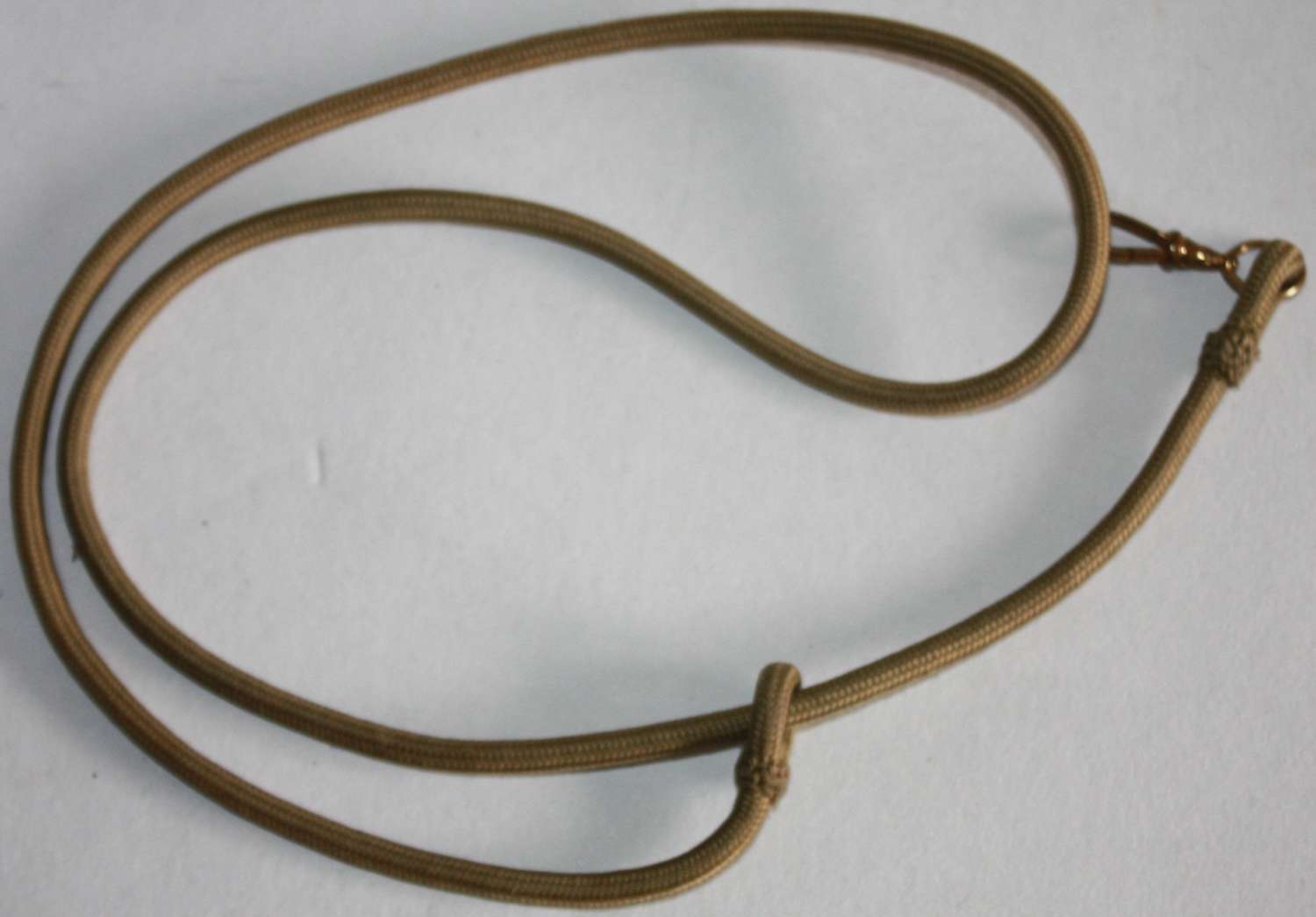 A GOOD WWI / WWII OFFICERS WHISTLE LANYARD
