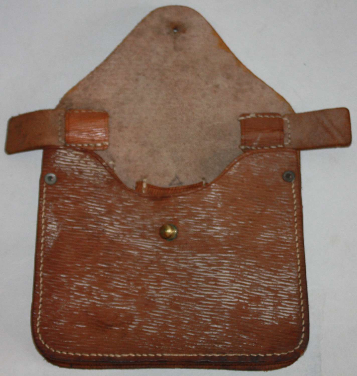 A 1942 DATED LEATHER FOLDING SAW POUCH