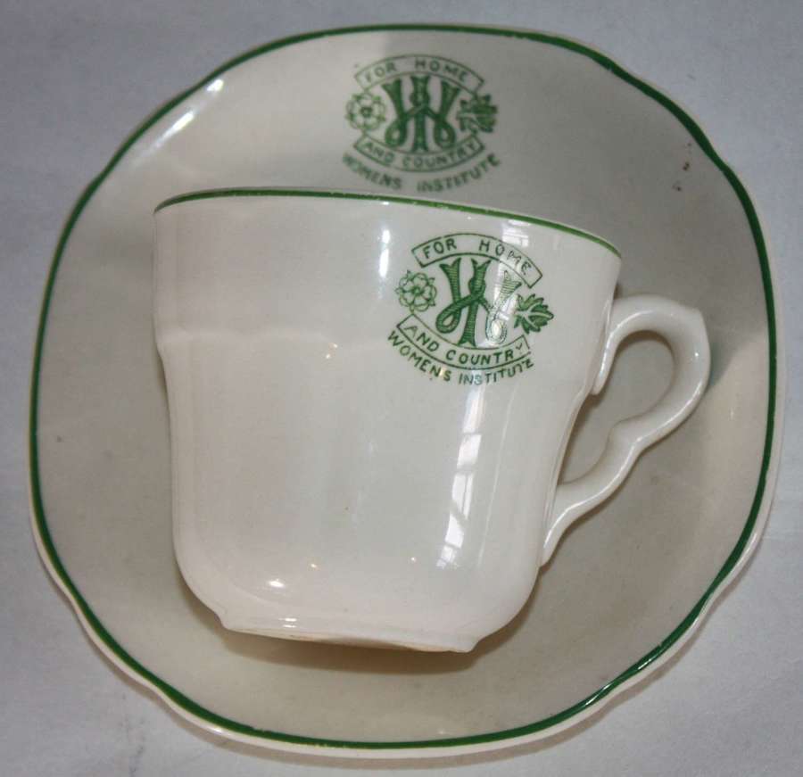 A WWII PERIOD WOMENS INSTITUTE TEA CUP AND SAUCER