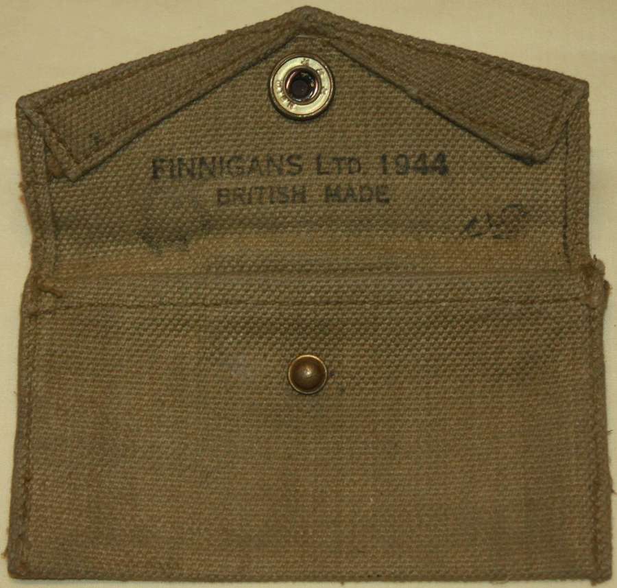 A 1944 DATED BRITISH MADE ( FINNIGANS LTD ) US CARLISE DRESSING POUCH