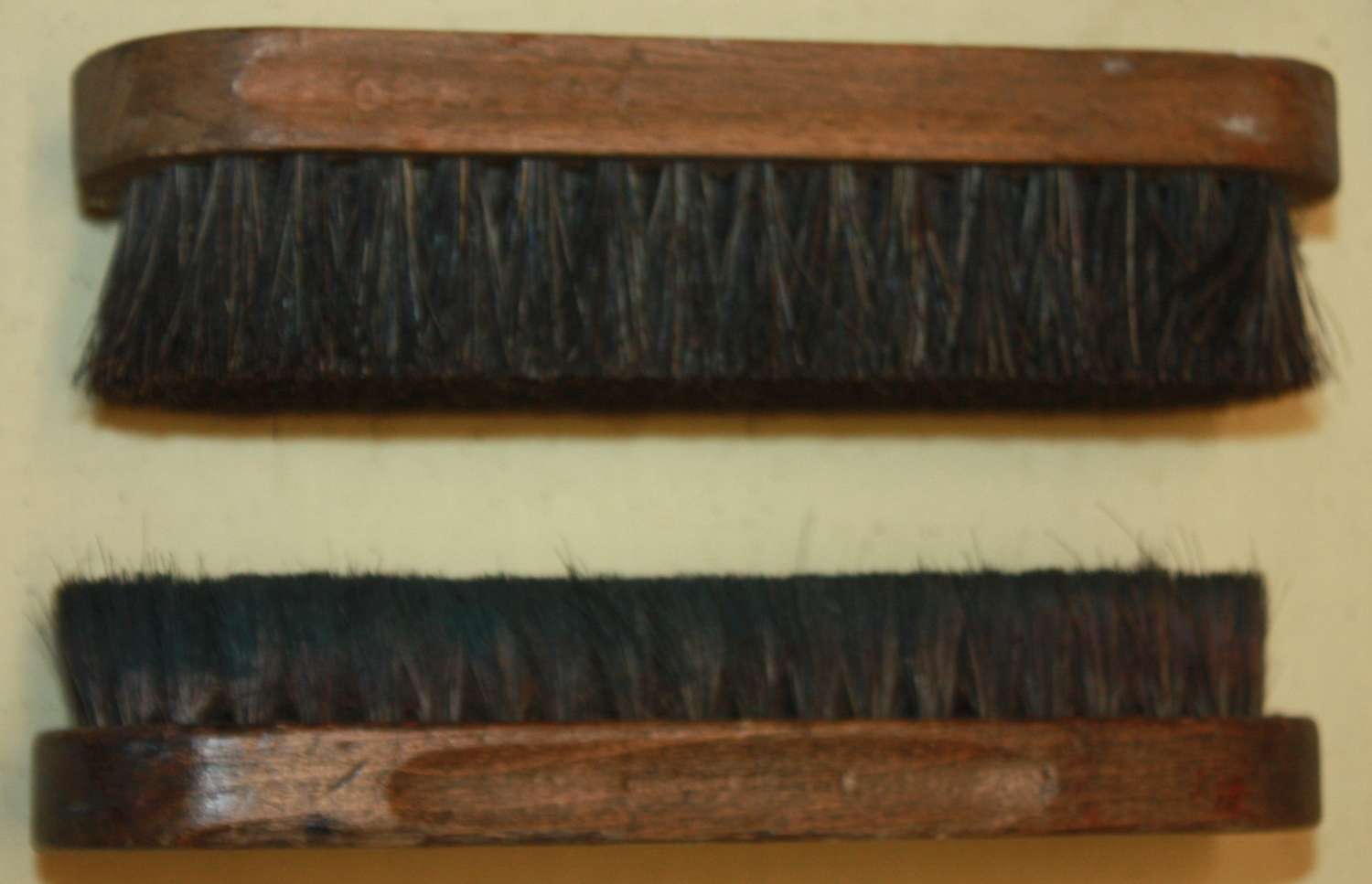 A PAIR OF WWII PERIOD BOOT BRUSHES BOTH HAVE BEEN USED