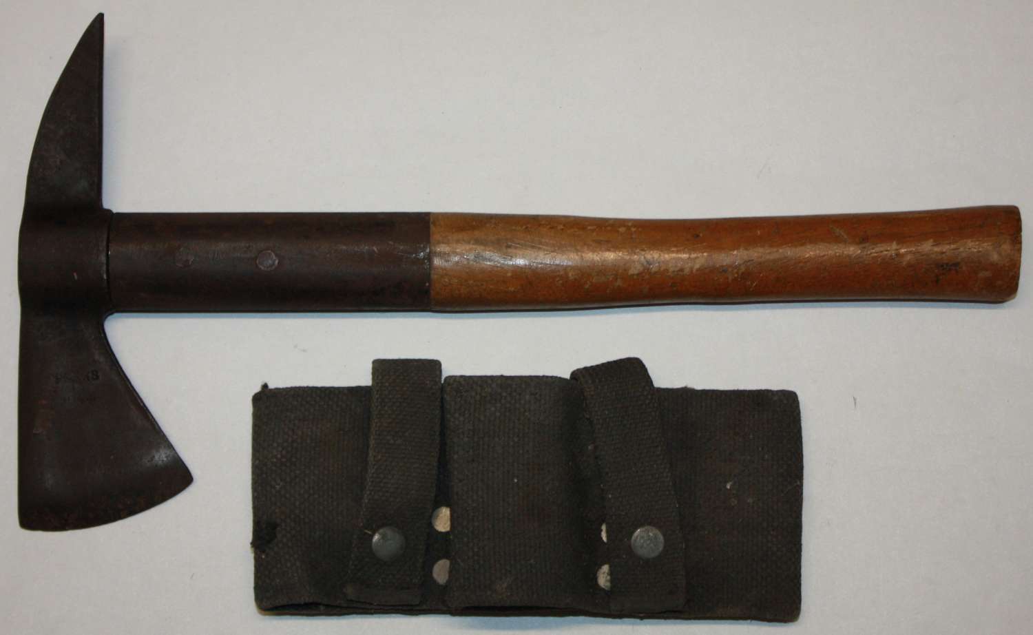 A GOOD 1944 DATED NFS / AFS AXE AND WEBBING POUCH
