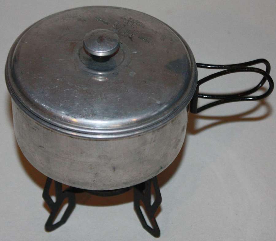 A WWII PERIOD GERMAN DRGM MARKED SWISS MADE DRINKING CUP AND HEATER