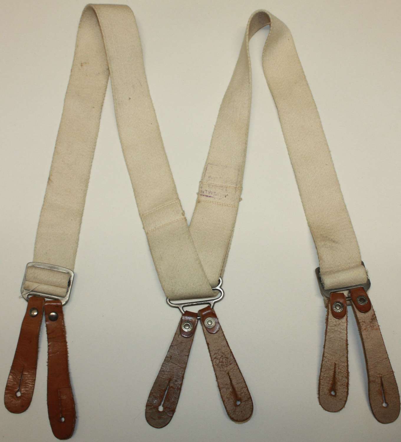 A PAIR OF 1940 DATED TROUSER BRACES