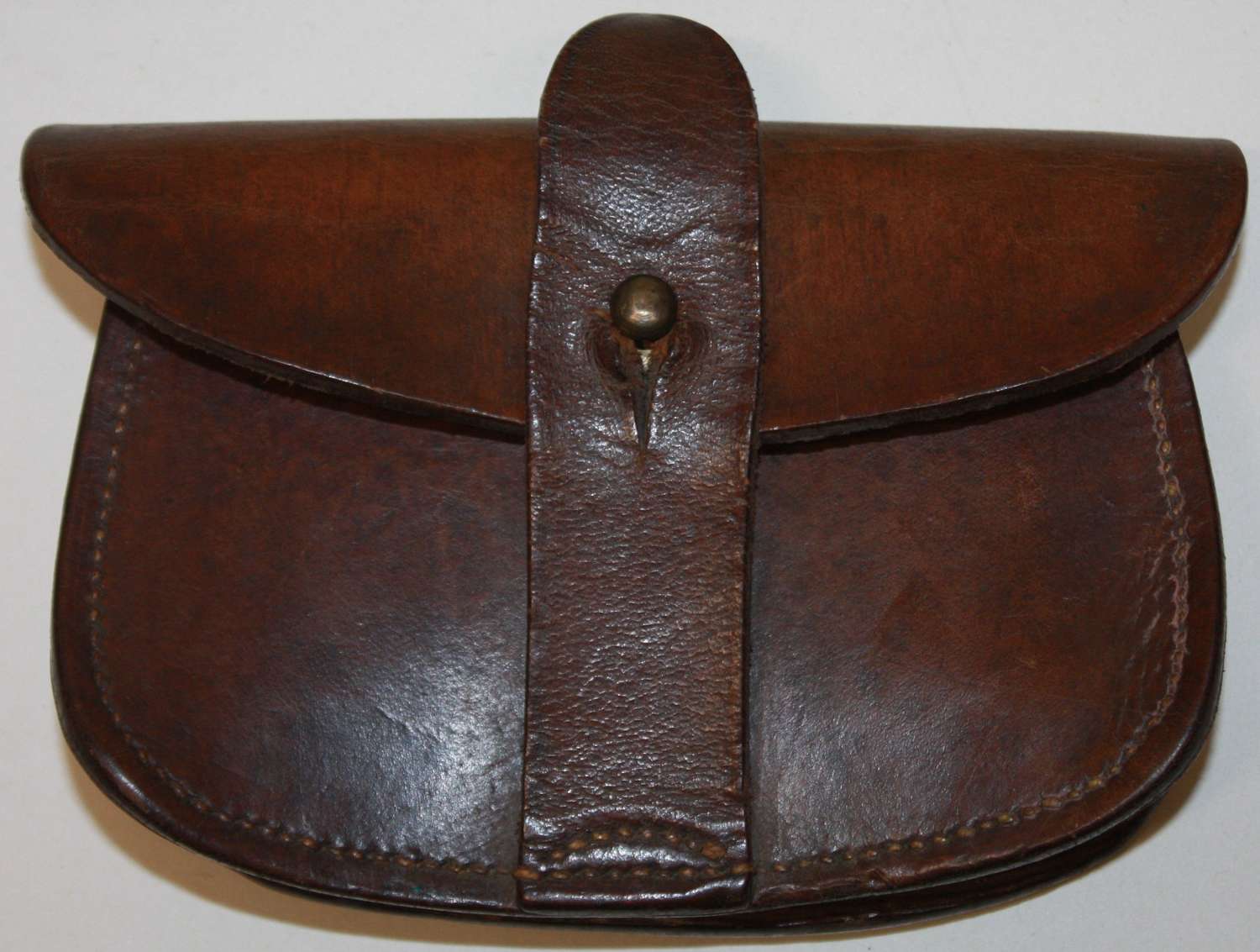 A WWI 1917 DATED SAM BROWN PISTOL AMMO POUCH