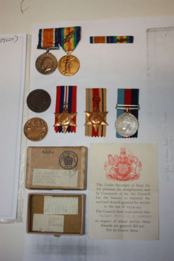 A SCARCE FATHER AND SON GROUP OF WWI AND WWII MEDALS