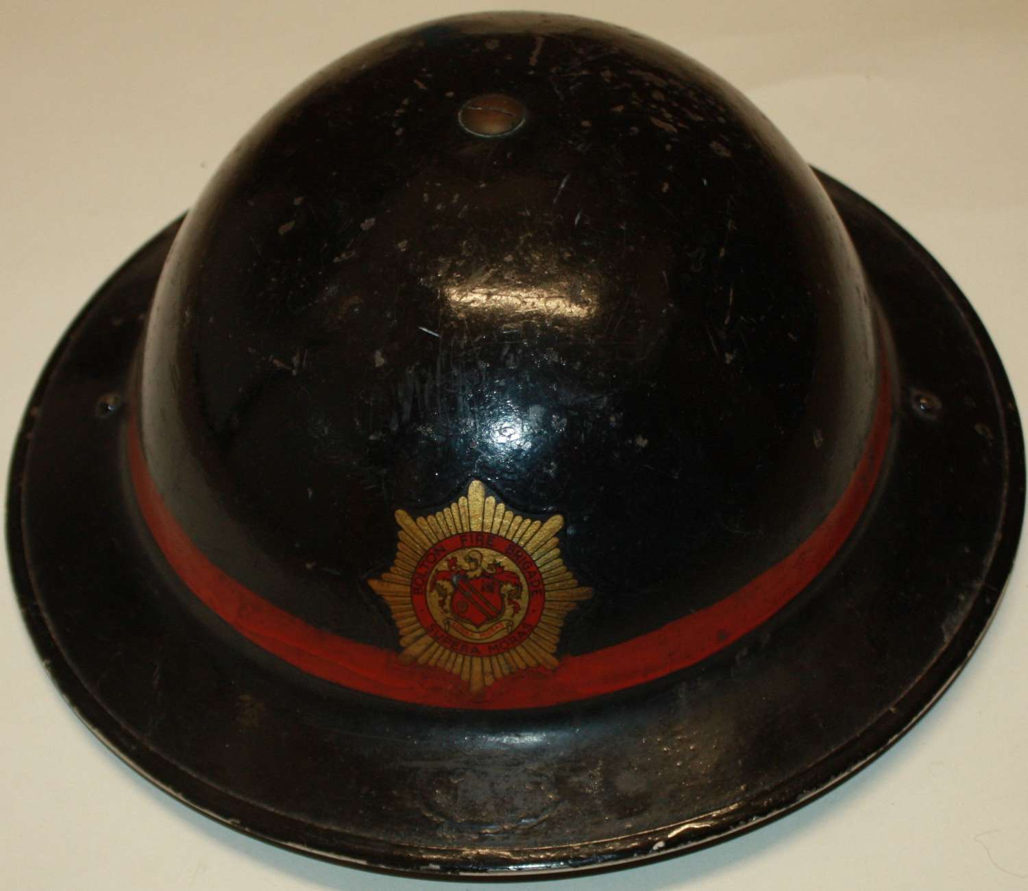 A REUSED WWII 1950'S FIRE BRIGADE HELMET LEADING FIREMAN FROM BOLTON