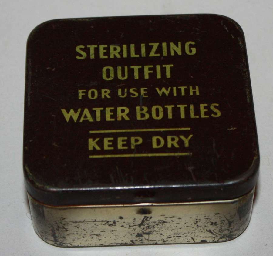 A GOOD BLACK SCREW CAP EXAMPLE OF THE STERILIZING OUTFIT 