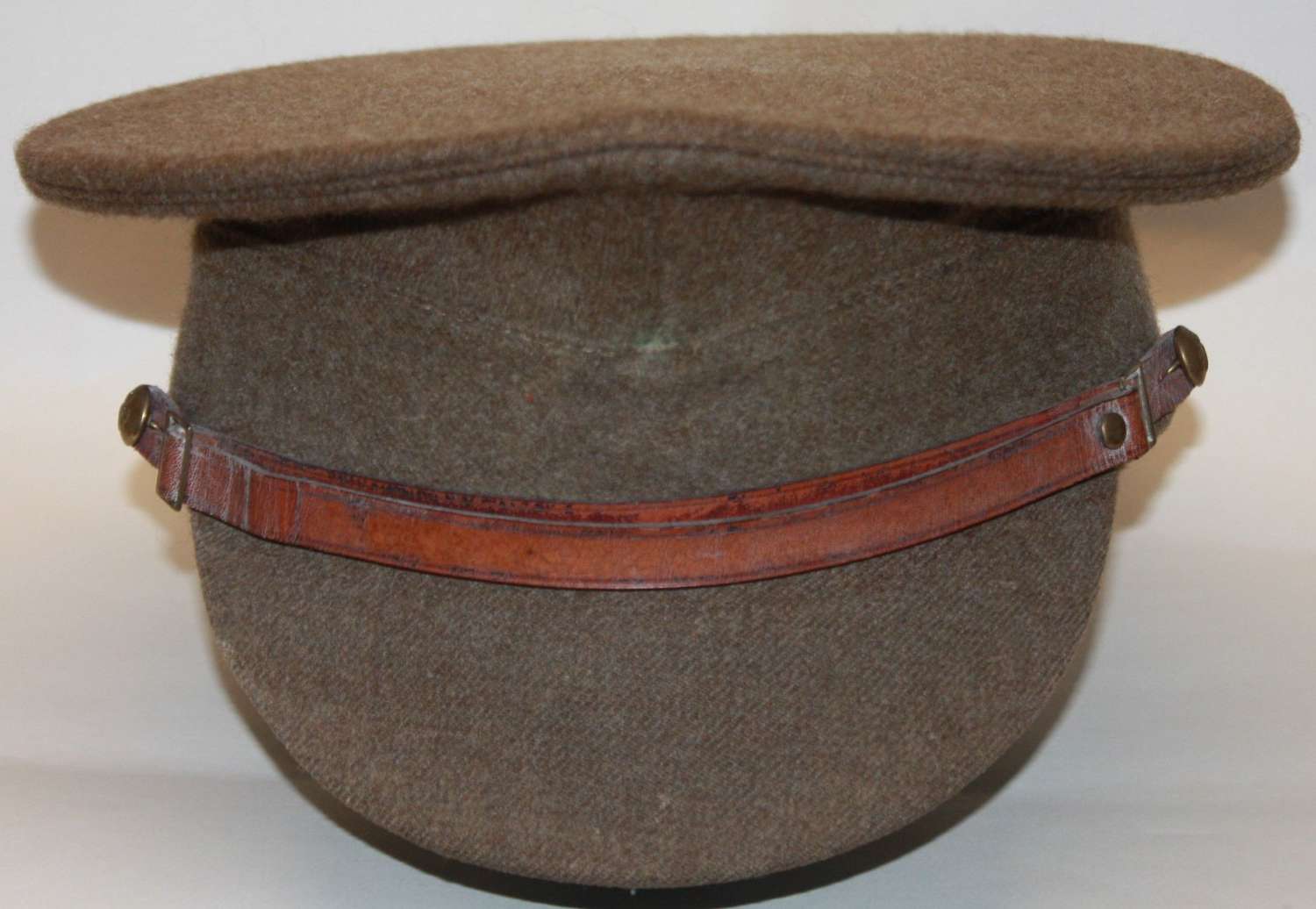 A 1922 pattern British issue peaked cap this a post WWII EXAMPLE