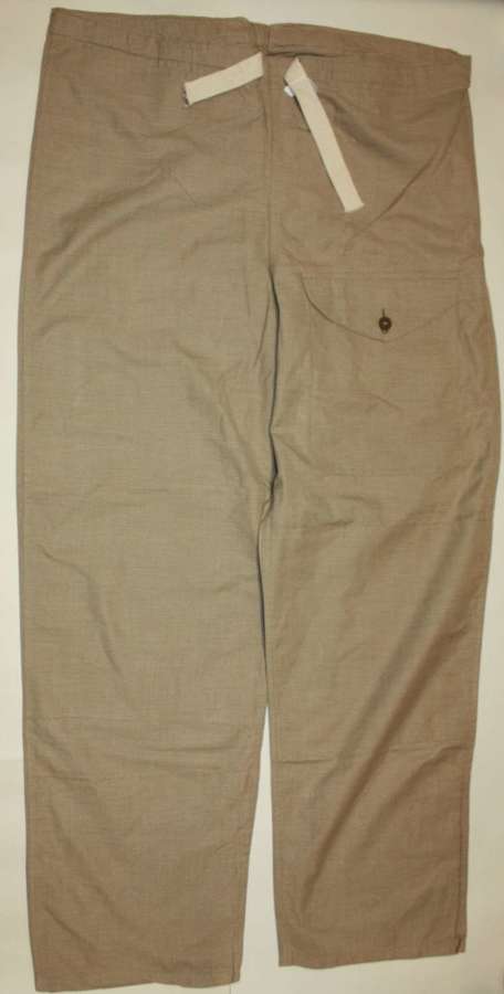 A PAIR OF 1942 DATED TAN WINDPROOF TROUSERS