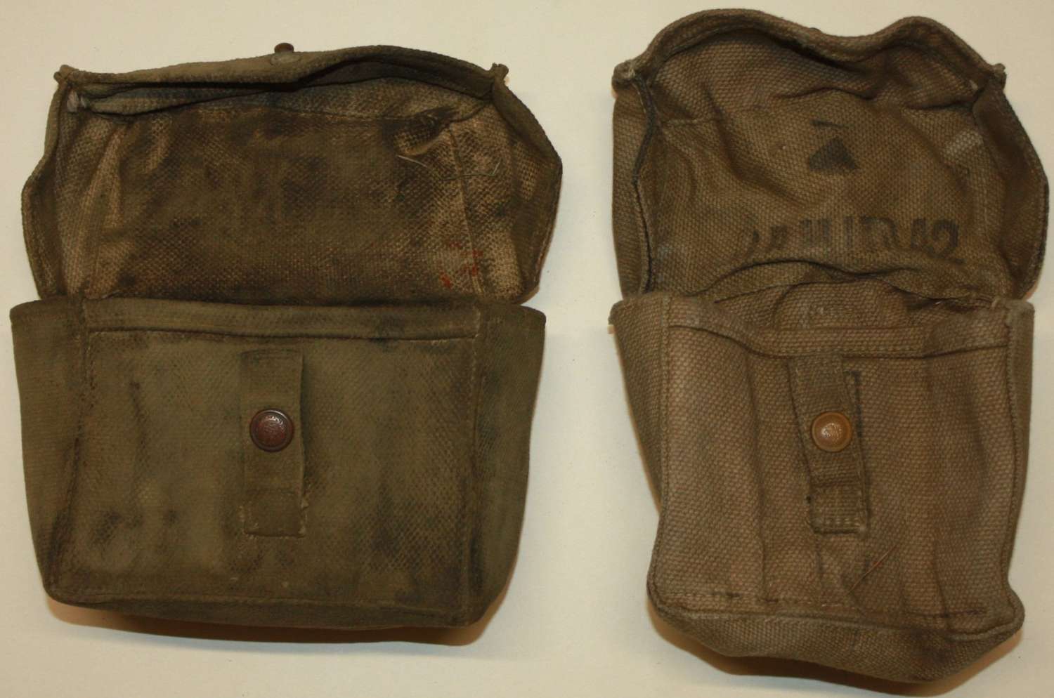 A GOOD BUT GRUBBY PAIR OF HOME GUARD AMMO POUCHES