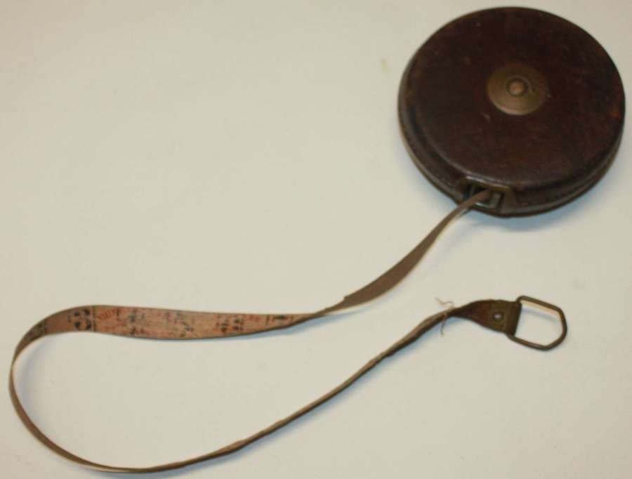 A BRITISH 1945 DATED 50FT TAPE MEASURE