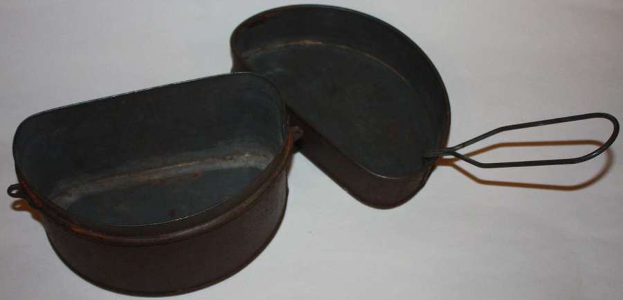A 1934 DATED SET OF D SHAPPED MESS TINS