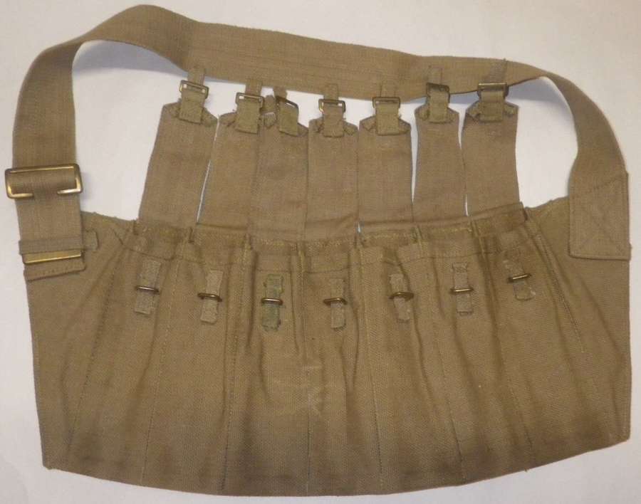 A WWII 7 POUCH STEN BANDOLIER WHICH IS 1944 DATED