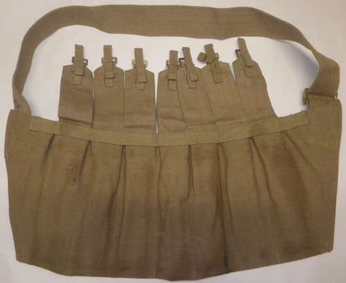 A WWII 7 POUCH STEN BANDOLIER WHICH IS 1944 DATED