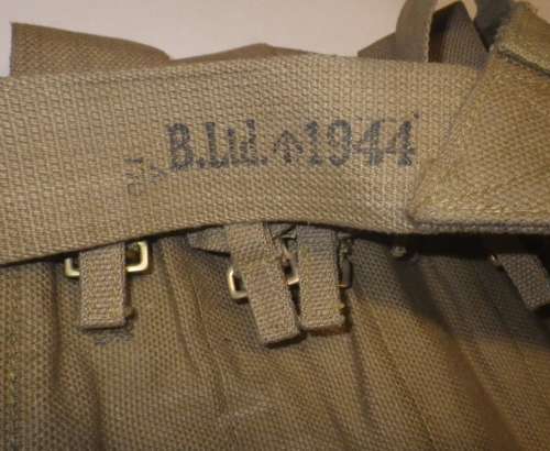 A WWII 7 POUCH STEN BANDOLIER WHICH IS 1944 DATED